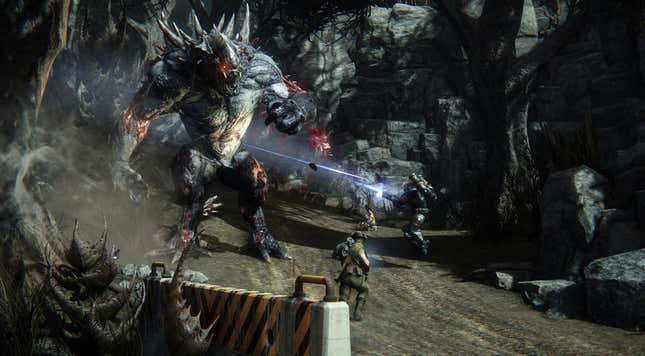 An Evolve image showing some soldiers shooting up a giant monster with spikes on its back.