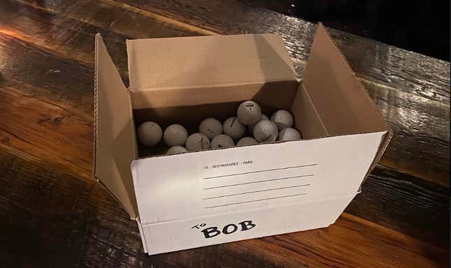 The What The Golf team’s box of golf balls